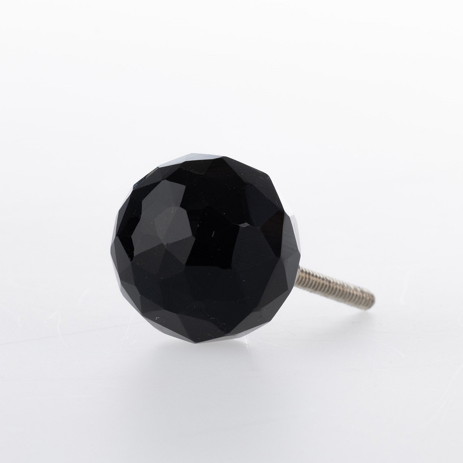Black faceted glass drawer knob with a jewel-inspired design and silver-tone metal fitting.