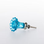 Blue flower-shaped glass drawer knob with a faceted translucent finish and silver-tone metal fitting.

Style: