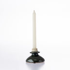 Design Republique Atene Candle Holder in a glossy dark ceramic finish, displayed with a white taper candle on a white background.