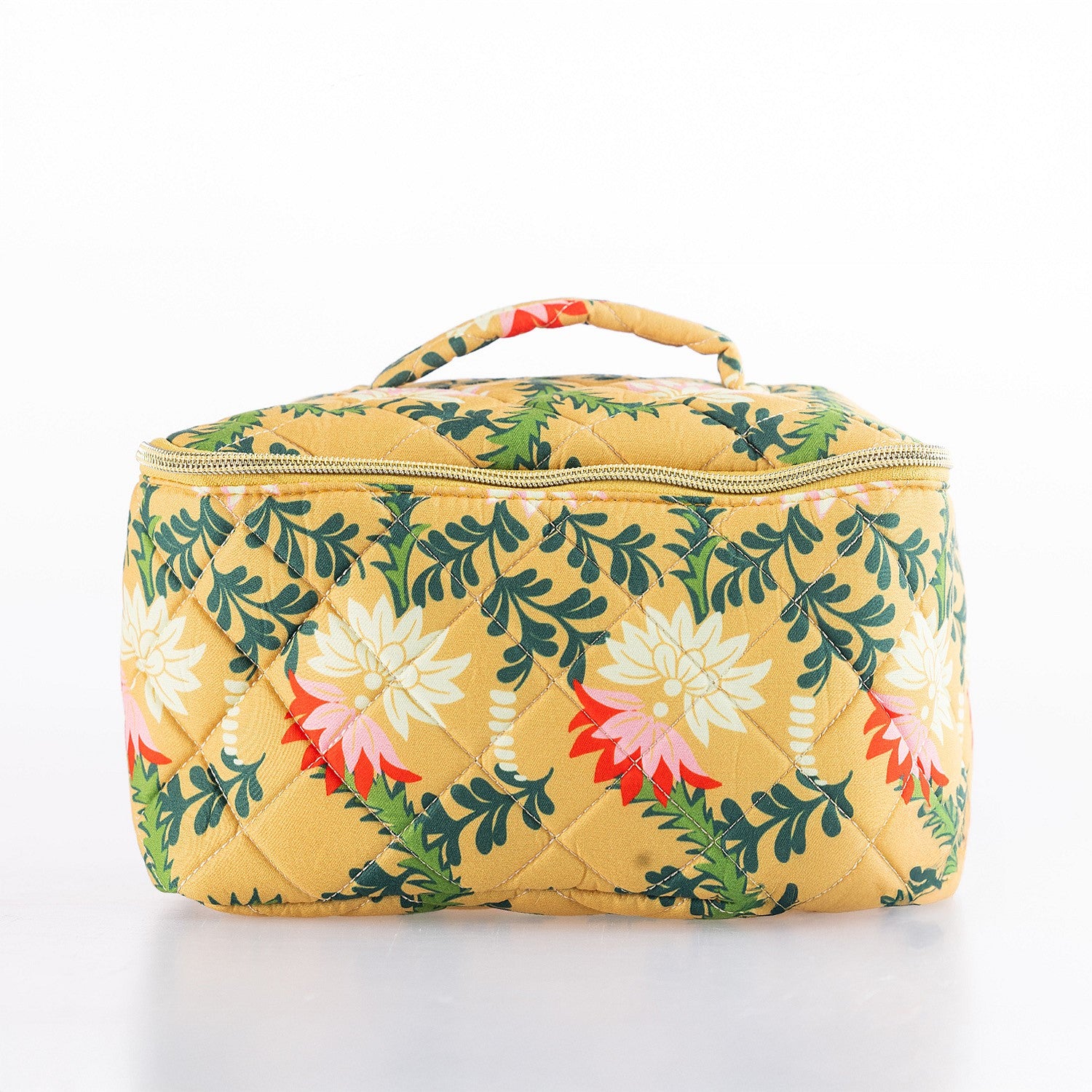 Large quilted floral toiletry bag in a mustard yellow print with top handle and zip closure.