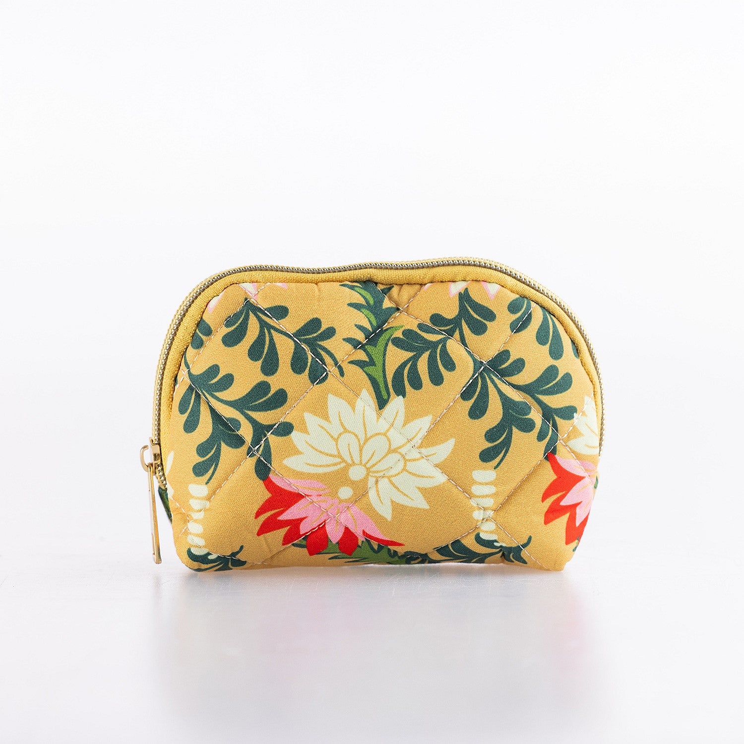 Small quilted floral cosmetic pouch with zip closure in a mustard yellow print.
