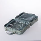 Open blue woven-look vanity case with mesh and clear zip compartments for organised cosmetic and travel storage on a white background.
