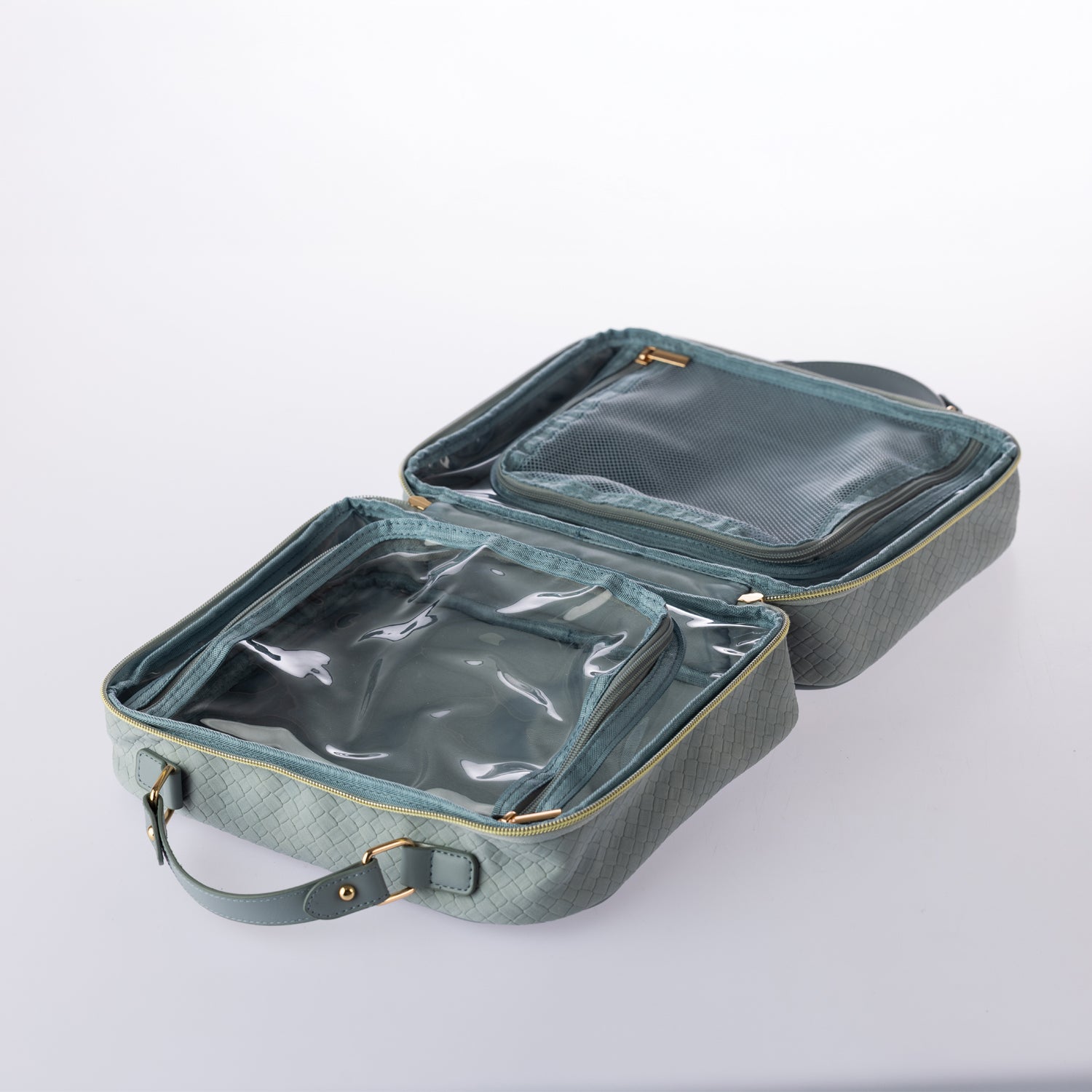 Open blue woven-look vanity case with mesh and clear zip compartments for organised cosmetic and travel storage on a white background.
