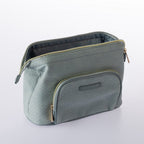 Open blue woven-look cosmetic bag with front zip pocket, spacious interior, and gold zip detailing on a white background.
