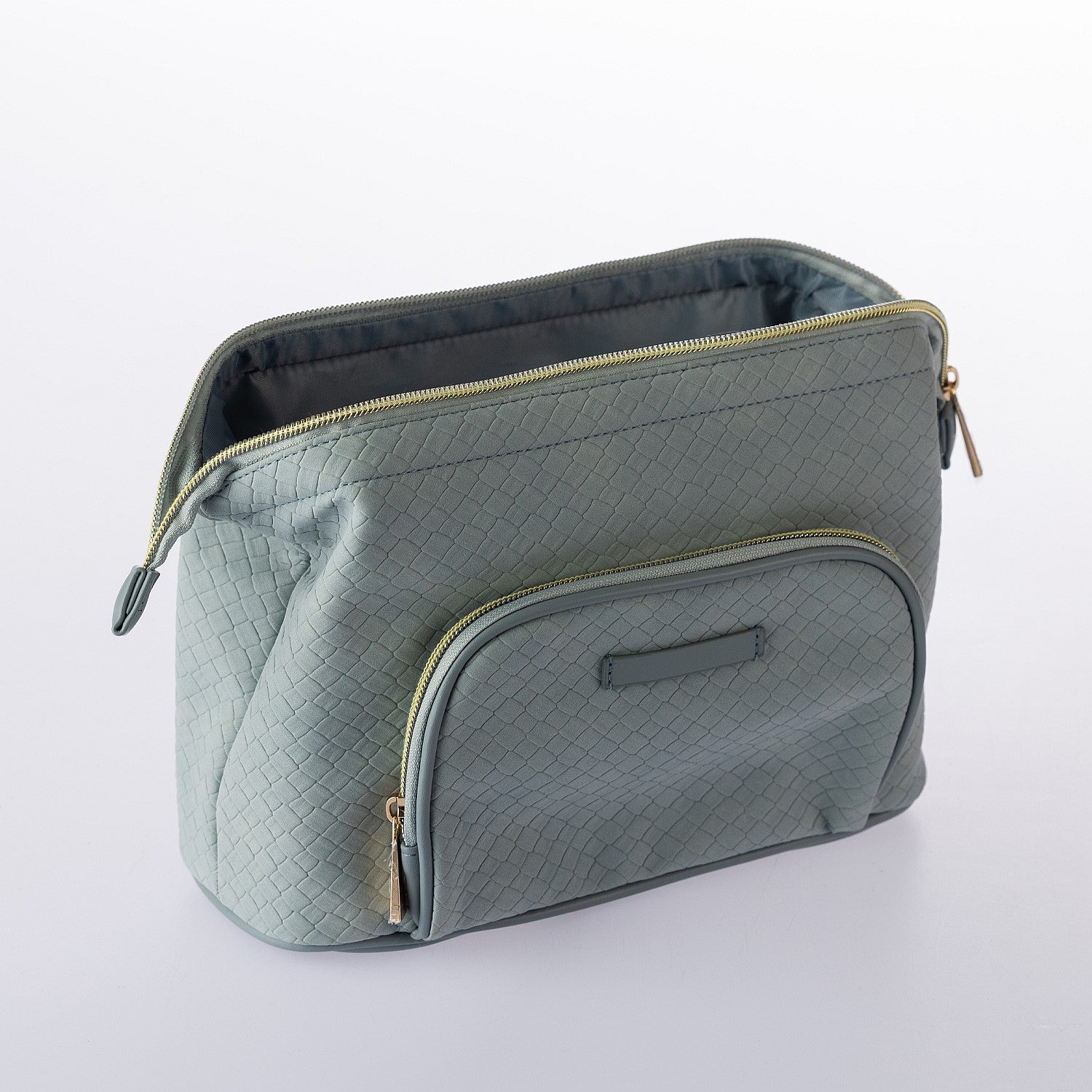 Open blue woven-look cosmetic bag with front zip pocket, spacious interior, and gold zip detailing on a white background.
