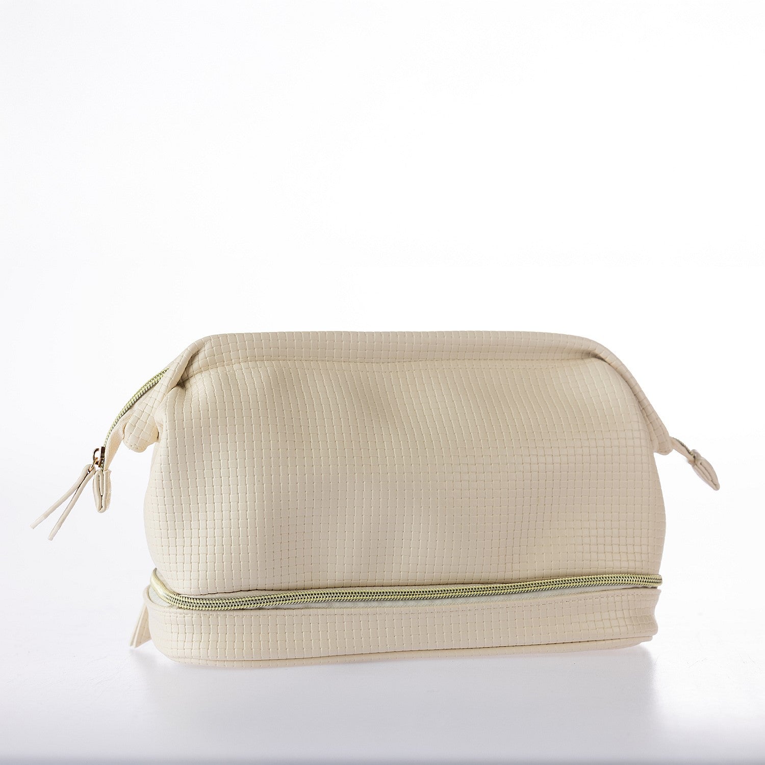 Cream textured cosmetic organiser bag with dual zip compartments and gold hardware on a white background.