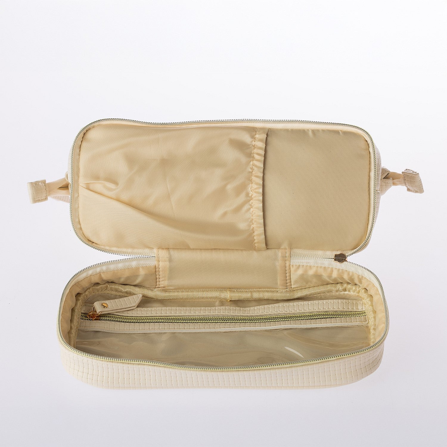 Fully opened cream cosmetic organiser bag featuring internal zip pocket and organised storage sections on a white background.