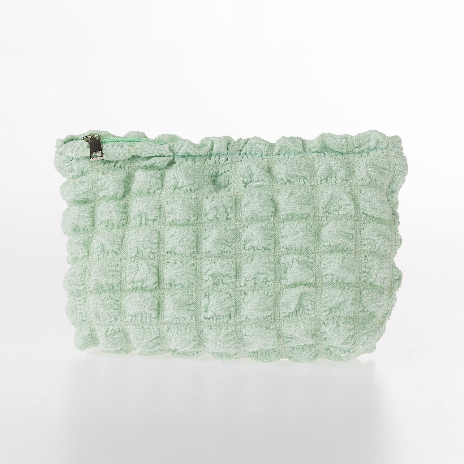 Mint Green textured waffle cosmetic pouch with soft padded finish and zip closure on a white background.