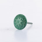 Green ceramic round drawer knob with embossed floral pattern detailing and metal screw fitting.