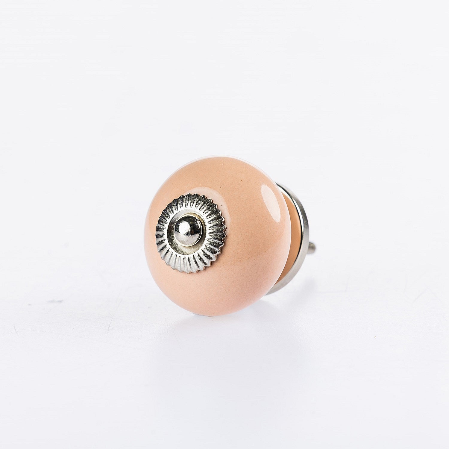 Light Coral round ceramic drawer knob with silver metal centre accent and glossy finish.