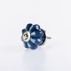 Denim & White flower-shaped ceramic drawer knob with white heart pattern detailing and silver metal centre accent.