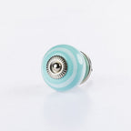 Ocean Blue round ceramic drawer knob with silver metal centre accent and glossy finish.
