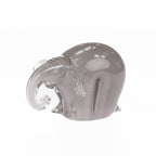 Smoke grey hand-blown glass elephant figurine with a curled clear glass trunk and white spotted detailing, displayed against a white background.