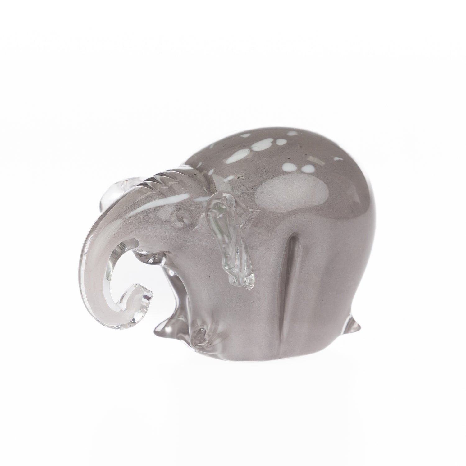 Smoke grey hand-blown glass elephant figurine with a curled clear glass trunk and white spotted detailing, displayed against a white background.