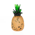 Large hand-blown glass pineapple décor with an amber textured body and dark green glass leaves.
