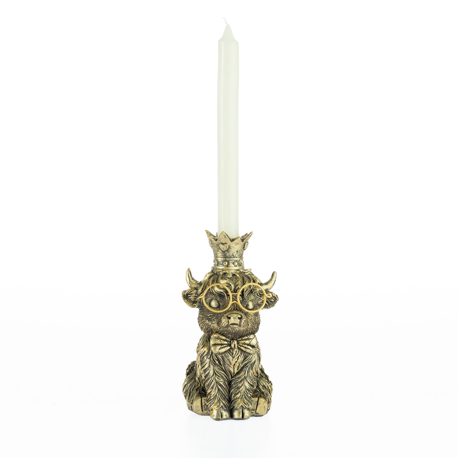 Decorative highland cow candleholder with gold glasses, bow tie, and crown holding a white tapered candle.