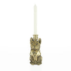 Decorative bulldog candleholder with gold-tone glasses holding a white tapered candle.