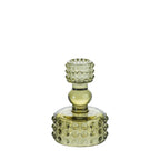 Light green glass candle holder with raised bubble detailing and a sculpted stem on a white background.