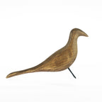 Brown decorative bird ornament side view with black metal legs on a white background.