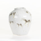 Large round ceramic vase with a reactive glaze finish on a white background.