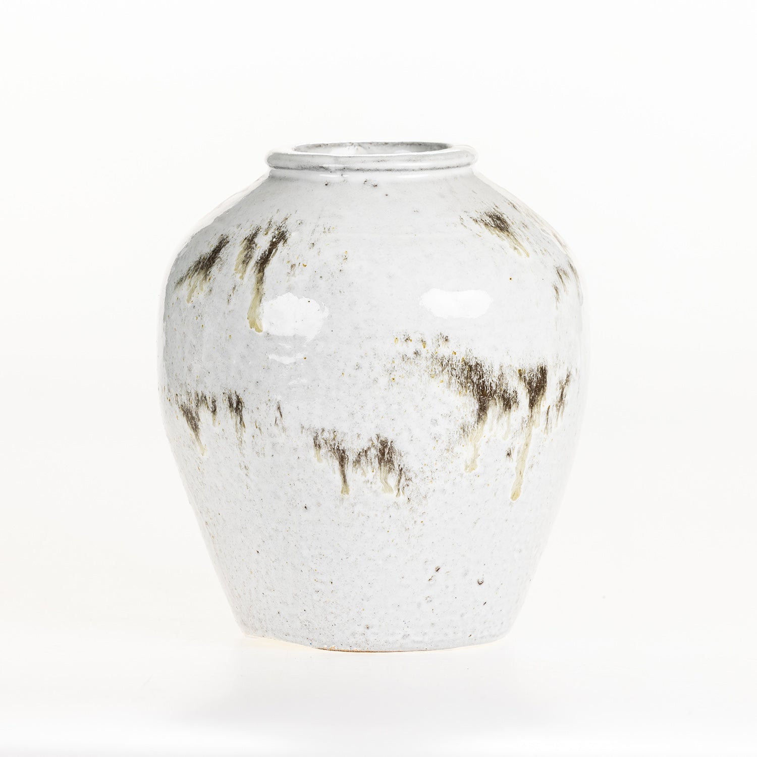 Large round ceramic vase with a reactive glaze finish on a white background.
