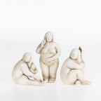 Three abstract ceramic lady figurines in natural stone-look finishes displayed together on a white background.