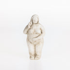 Abstract ceramic lady figurine in a natural stone-look finish on a white background.