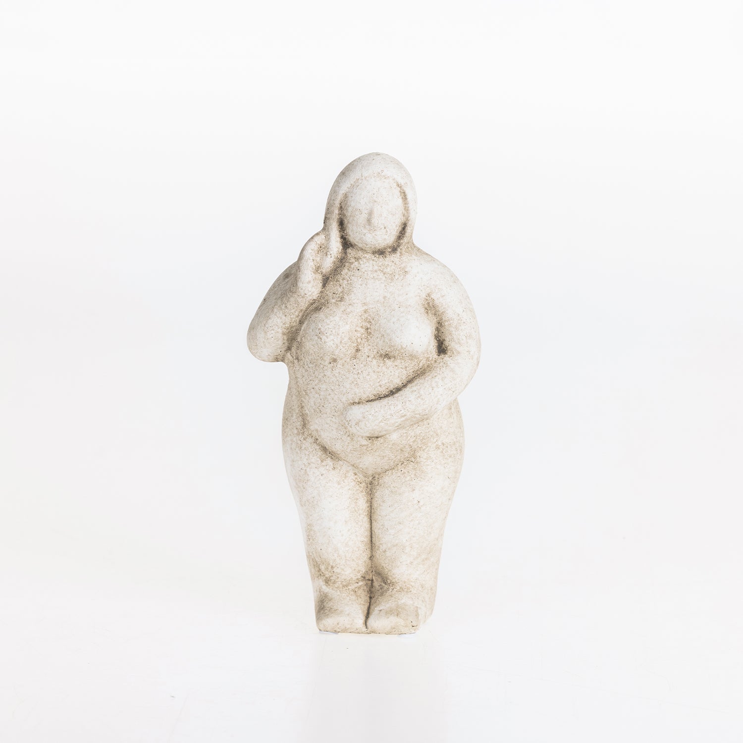 Abstract ceramic lady figurine in a natural stone-look finish on a white background.