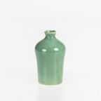 Tall glossy green ceramic vase with a rounded shoulder and narrow neck displayed on a white background.