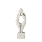 Cove Grayson Man In Thought Ornament in Natural, small size, featuring an abstract seated figure resting its face in its hands.