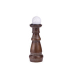 Design Republique Haven Candleholder in Cocoa, shown holding a white spherical candle.