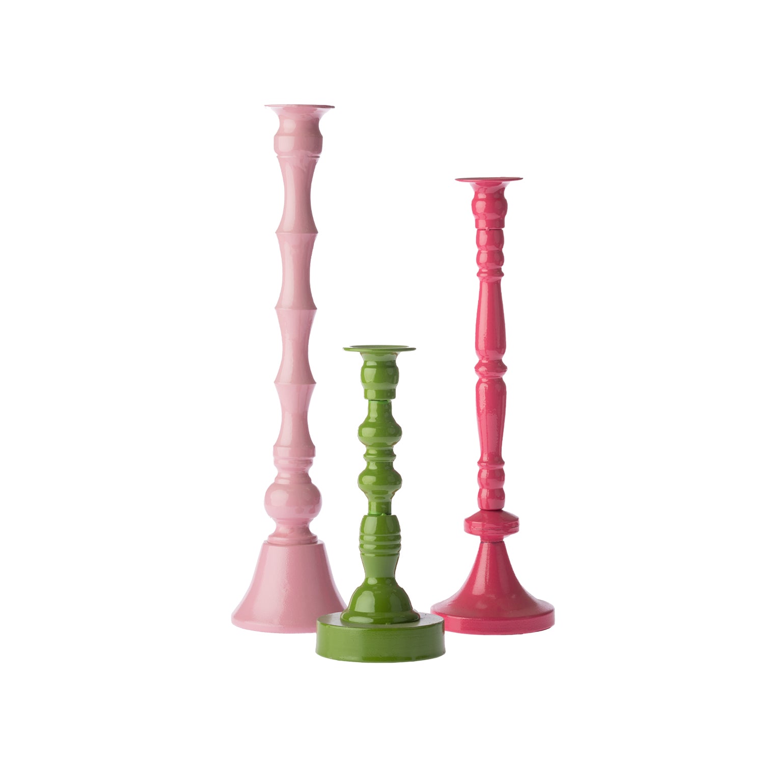 Three decorative candle holders in blush pink, green and fuchsia, shown together in varying heights against a white background.