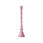 Blush pink decorative candle holder with a glossy finish, tall sculpted column design and flared base, shown against a white background.