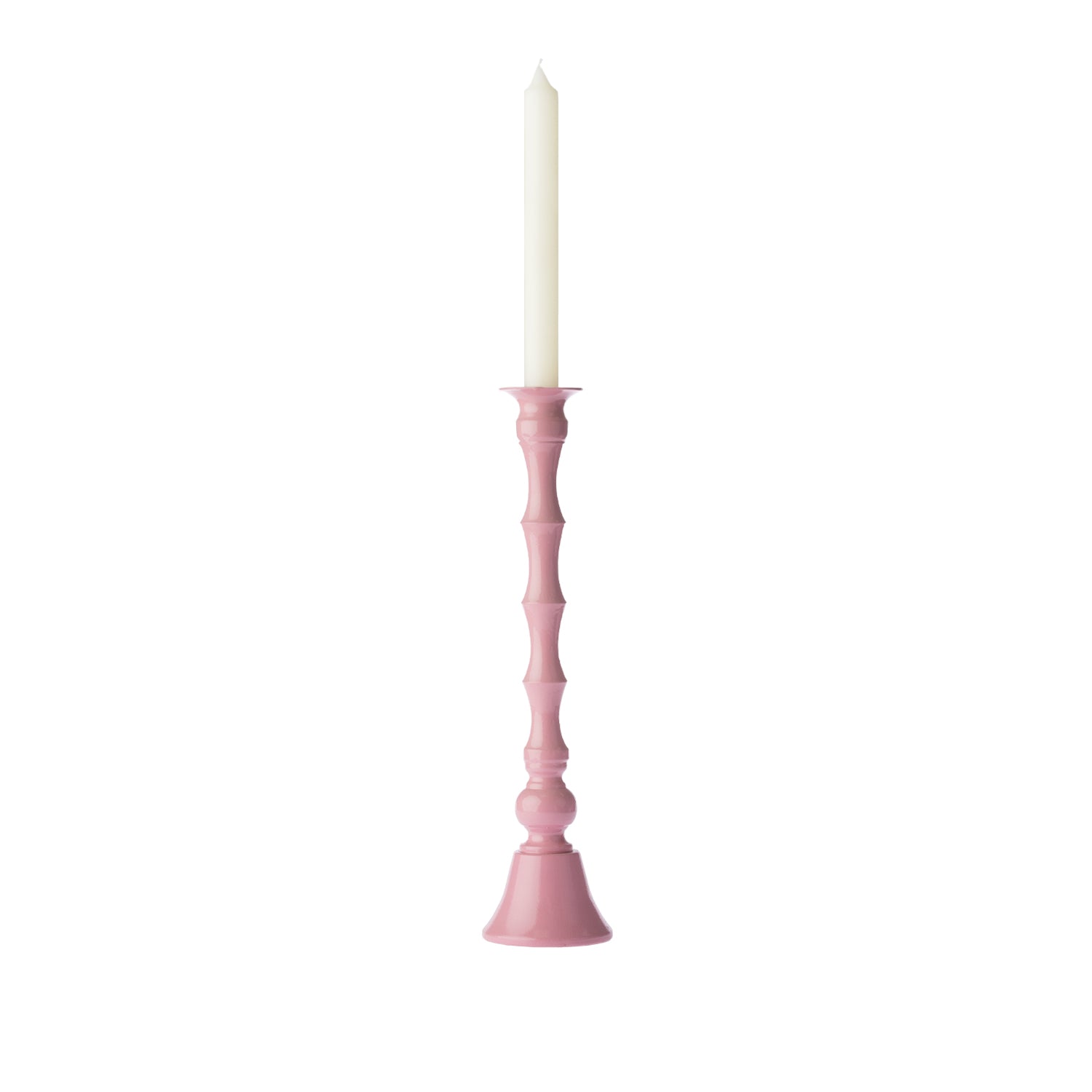 Blush pink decorative candle holder displayed with a tall white taper candle against a white background.