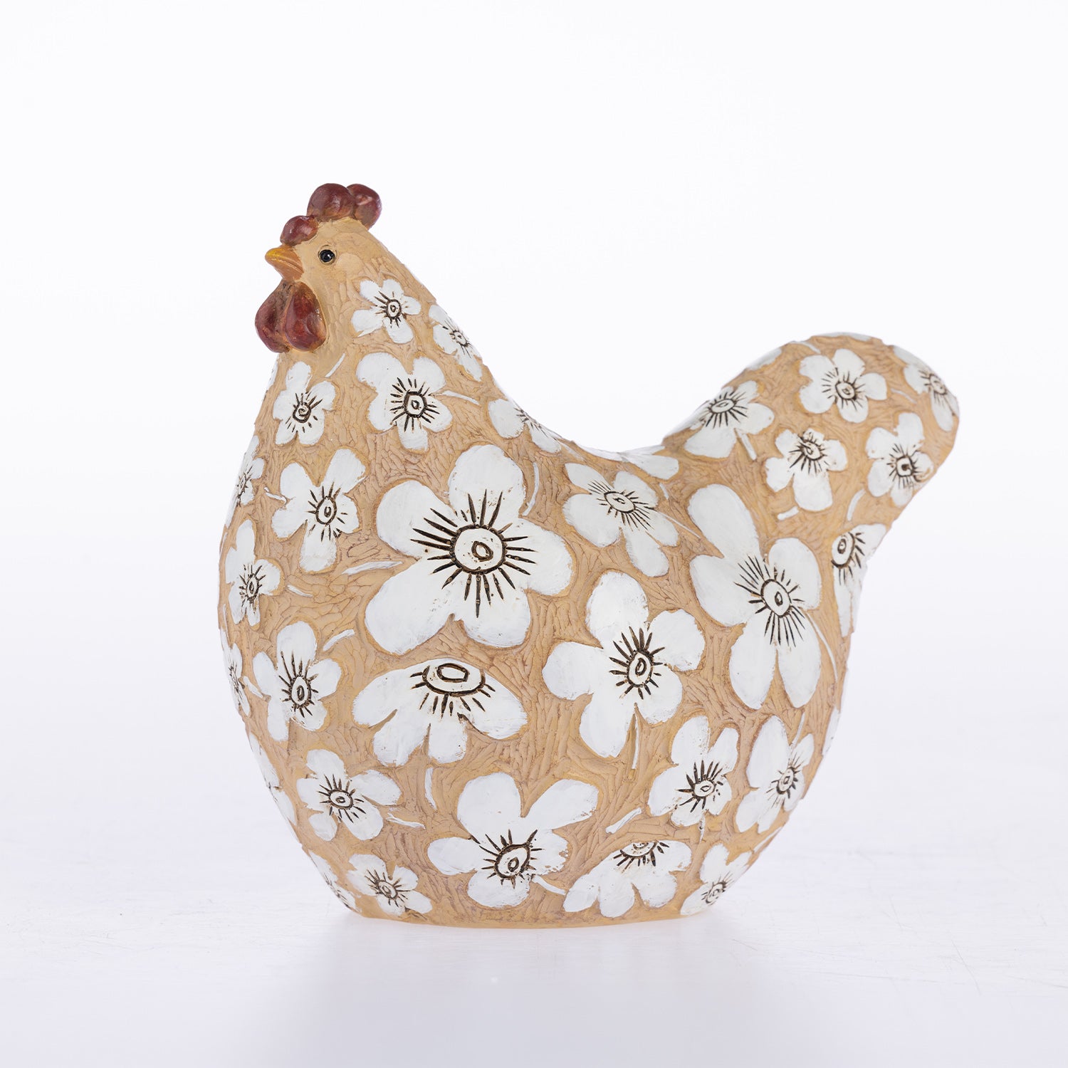 A decorative ceramic chicken figurine with a textured tan body, white floral pattern, and brown comb, shown on a clean white background.