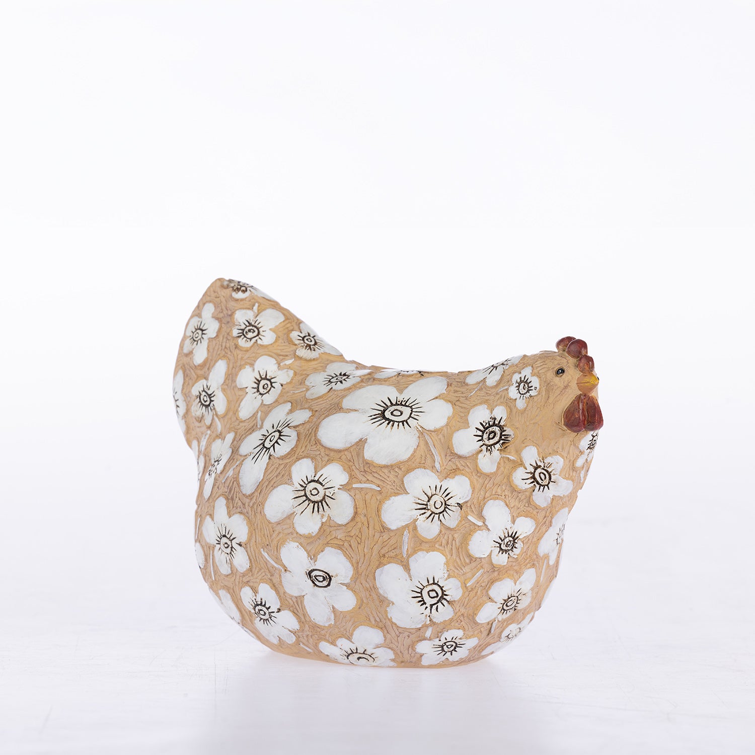 A ceramic chicken-shaped planter with a beige background, decorated with a white floral pattern and a brown comb, set against a plain white background.