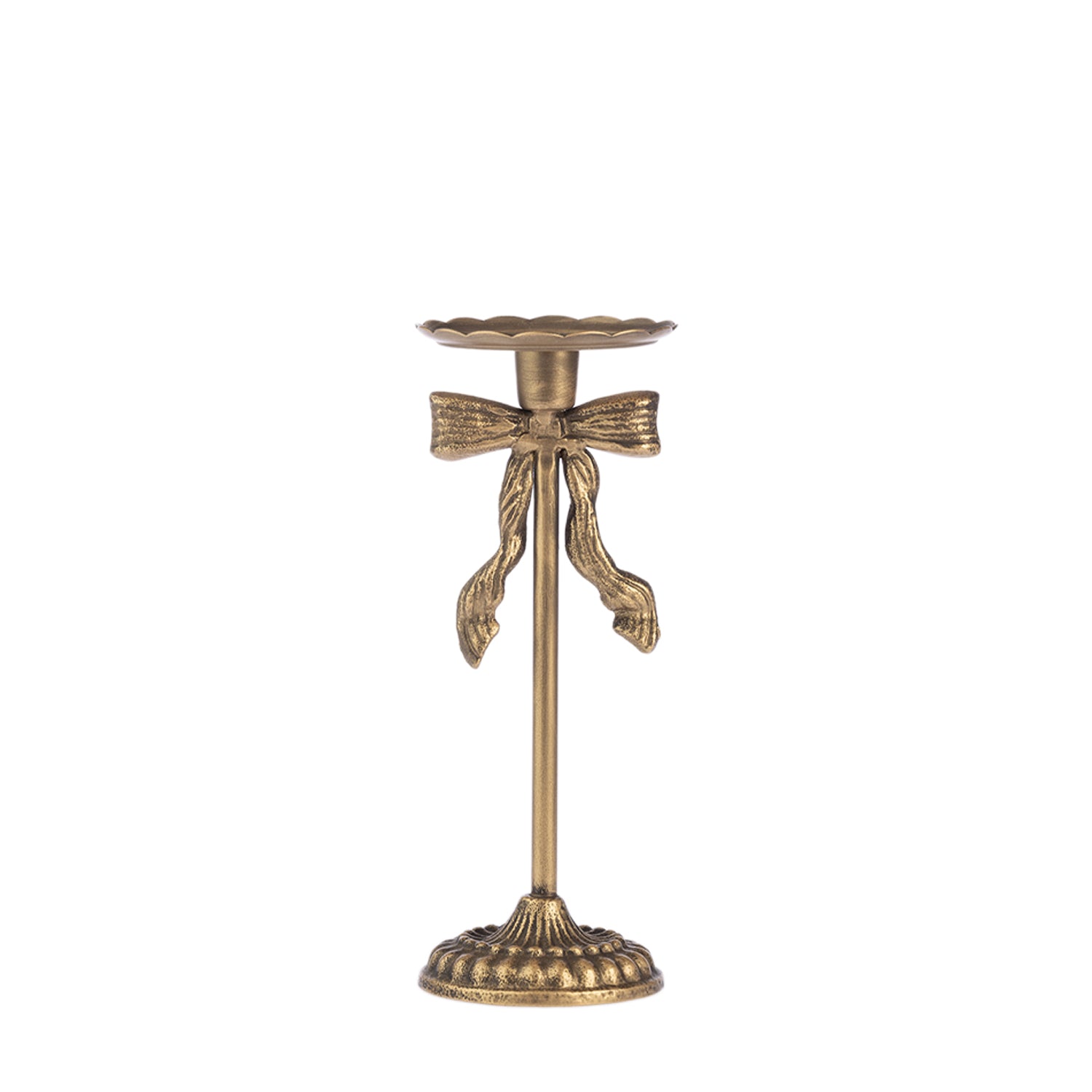 An antique bronze candlestick holder with a decorative bow detail on the stem, set against a plain white background.