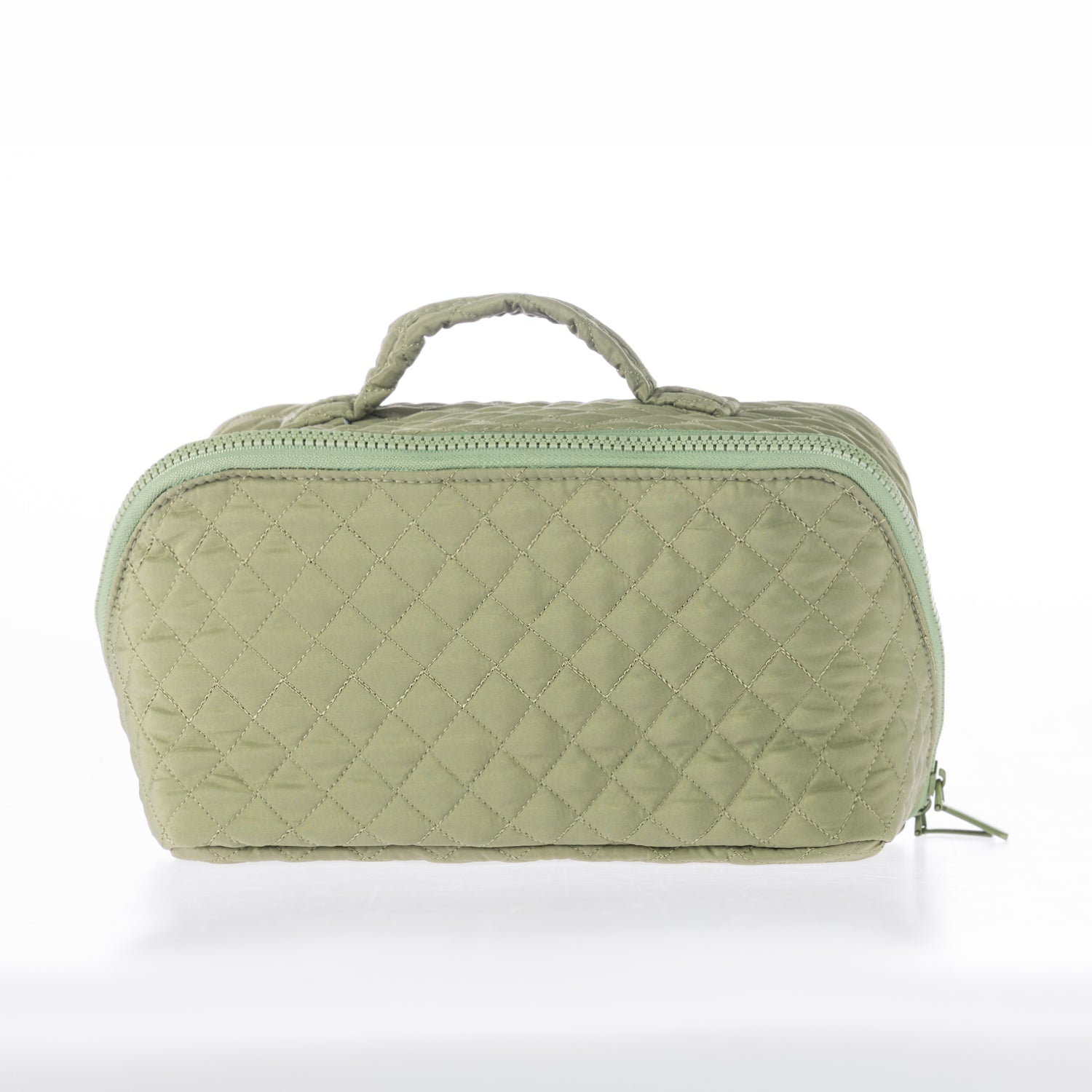 Light green quilted toiletry bag with a zip-around closure and top carry handle on a white background.