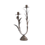 Antique bronze metal two-candle holder with decorative leaf detailing.