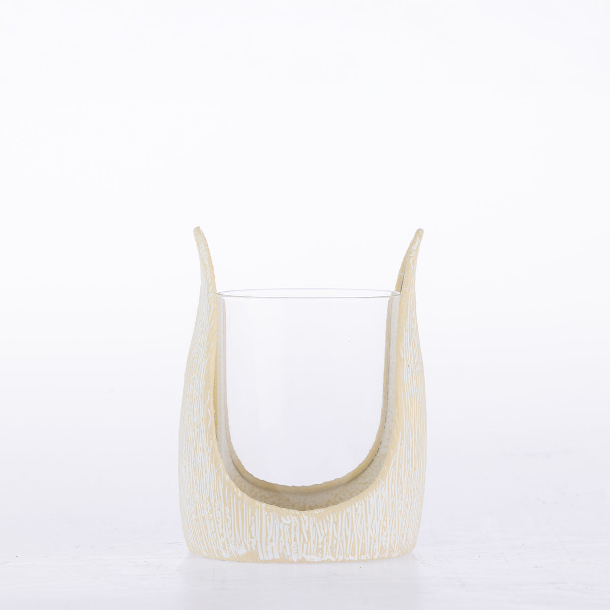 Ivory textured candle holder with a curved sculptural frame and clear glass insert.
