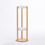 A tall white and natural bamboo planter stand with two display shelves offers a stylish, space-saving way to showcase indoor plants in a clean, contemporary setting.