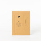 Gather 2 Piece Bamboo Board & Knife Set presented in a closed kraft cardboard gift box featuring an illustration of the board and knife.