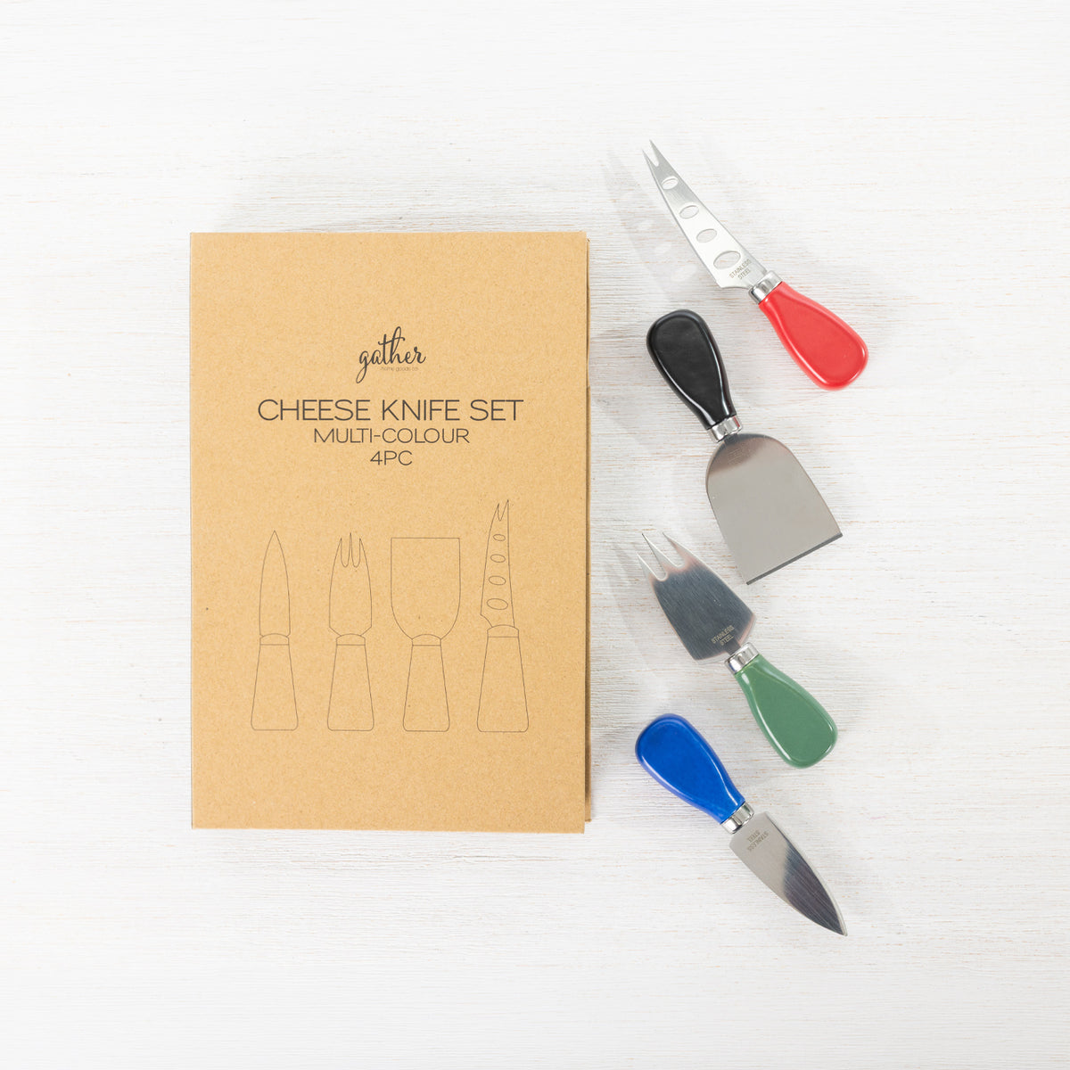 Gather 4 Piece Cheese Knife Set Multi-Coloured featuring stainless steel cheese utensils with red, black, green and blue handles beside the gift packaging.