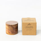 Gather Acacia Spice Container Set featuring a round natural acacia wood spice container with a fitted lid displayed beside its kraft cardboard packaging.