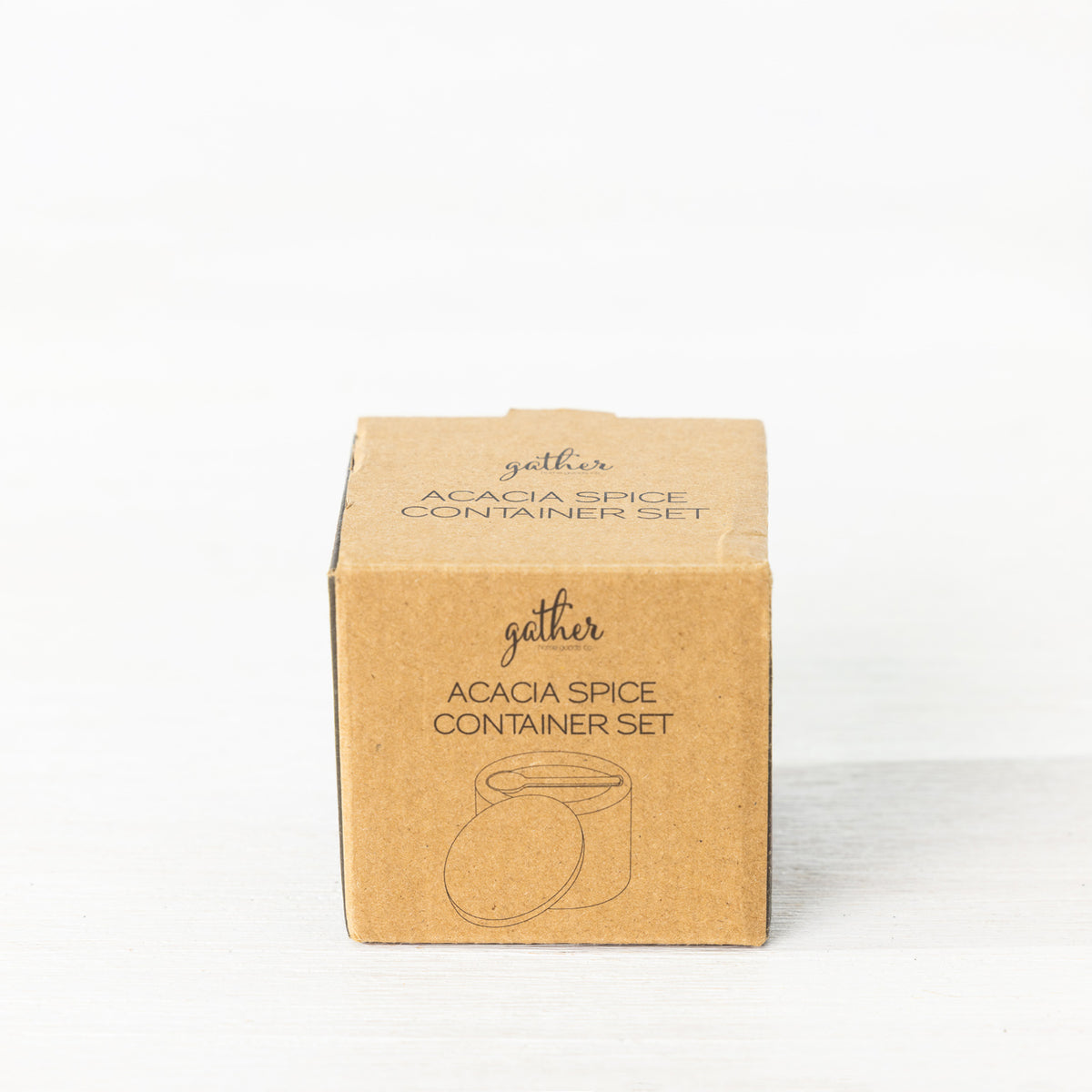 Gather Acacia Spice Container Set presented in a closed kraft cardboard box with branding and an illustration of the spice container, lid and spoon.