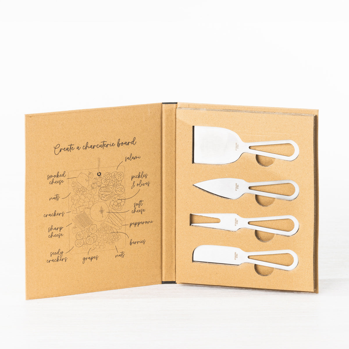 Gather 4 Piece Cheese Knife Set Silver displayed in open gift packaging with four different stainless steel cheese utensils and sleek silver open-handle designs.