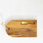 Gather 2 Piece Gold Knife & Acacia Board Set featuring a natural acacia wood serving board styled with cheese, crackers and strawberries alongside a gold-coloured cheese knife.