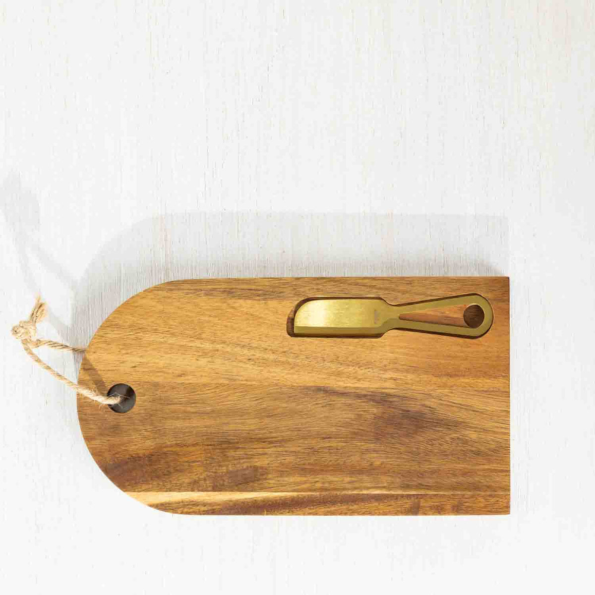 Gather 2 Piece Gold Knife & Acacia Board Set featuring a natural acacia wood serving board styled with cheese, crackers and strawberries alongside a gold-coloured cheese knife.