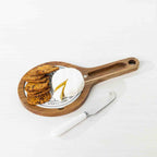 Gather 3 Piece Ceramic & Acacia Set Round featuring a round acacia wood serving board with a ceramic cheese insert, assorted crackers, soft cheese and a white-handled cheese knife.