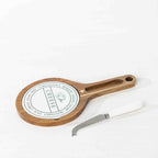 Gather 3 Piece Ceramic & Acacia Set Round featuring a round acacia wood serving board with a decorative ceramic insert and coordinating white-handled cheese knife.